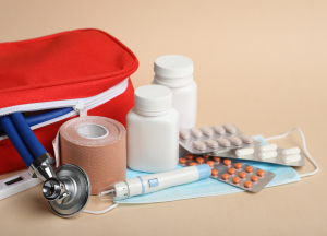 Compact red medical kit containing emergency medical supplies used by police officers.